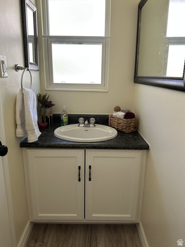 624 East Cutler Springville, UT 84663 - Photo 11 of 24 Downstairs Bathroom with a white vanity with shaker-style cabinet doors and black hardware