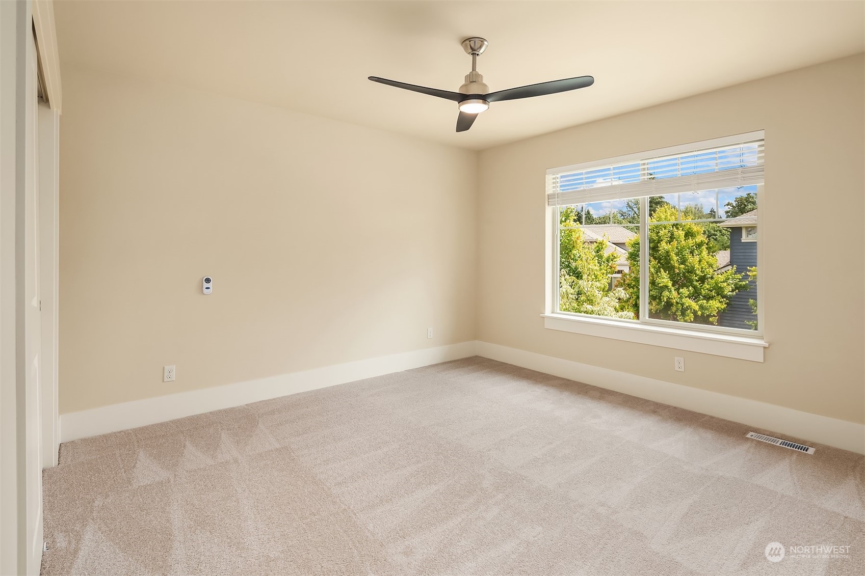 13949 174th Terrace Southeast Renton, WA 98059 - Photo 33 of 38 an empty room with a window and a ceiling fan