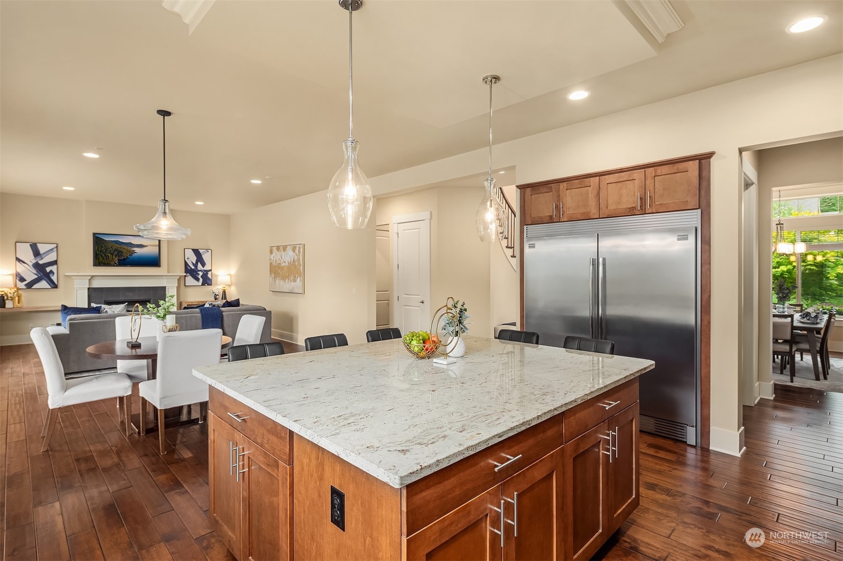 13949 174th Terrace Southeast Renton, WA 98059 - Photo 10 of 38 a kitchen with stainless steel appliances granite countertop a kitchen island a cabinets and wooden floor