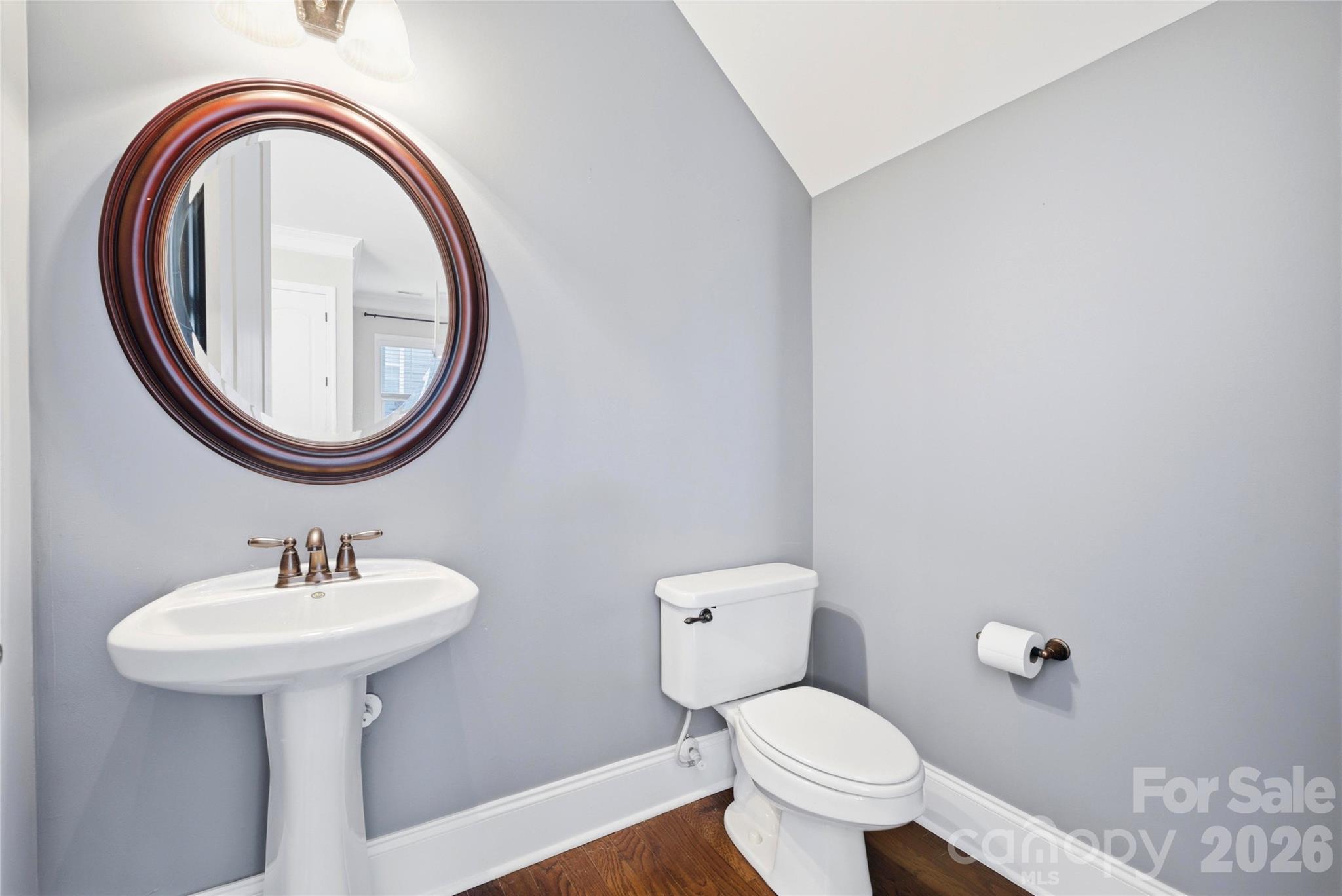 10227 Sam Meeks Road Pineville, NC 28134 - Photo 11 of 27 a bathroom with a sink and a toilet