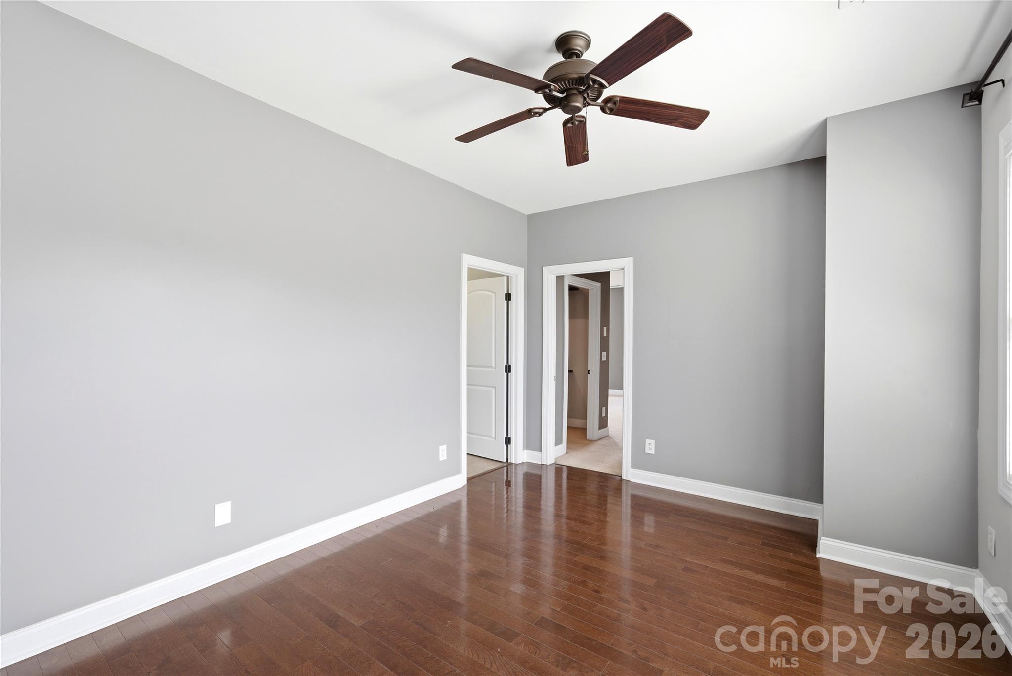 10227 Sam Meeks Road Pineville, NC 28134 - Photo 12 of 27 an empty room with wooden floor and windows