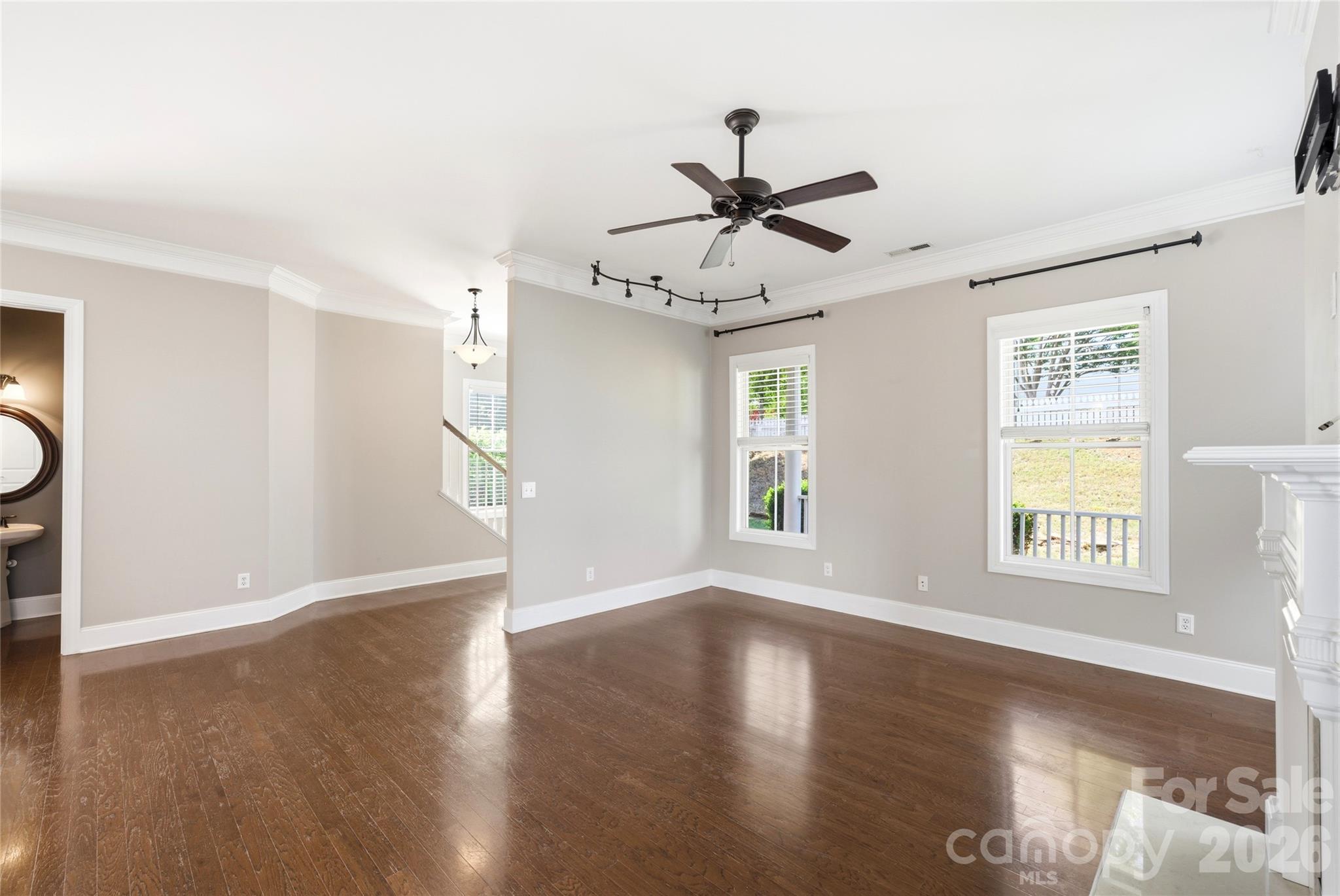 10227 Sam Meeks Road Pineville, NC 28134 - Photo 5 of 27 a view of an empty room with wooden floor and a window