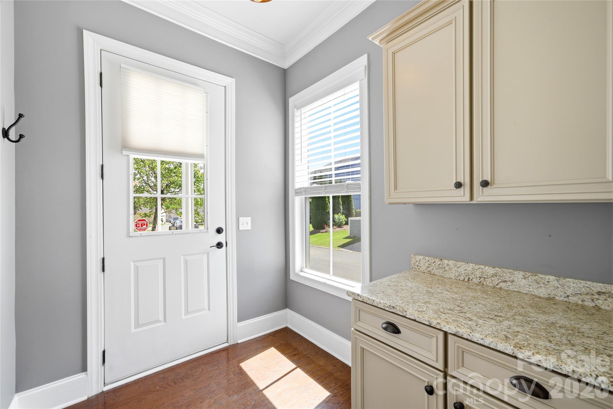 10227 Sam Meeks Road Pineville, NC 28134 - Photo 10 of 27 a kitchen with granite countertop white cabinets and a window