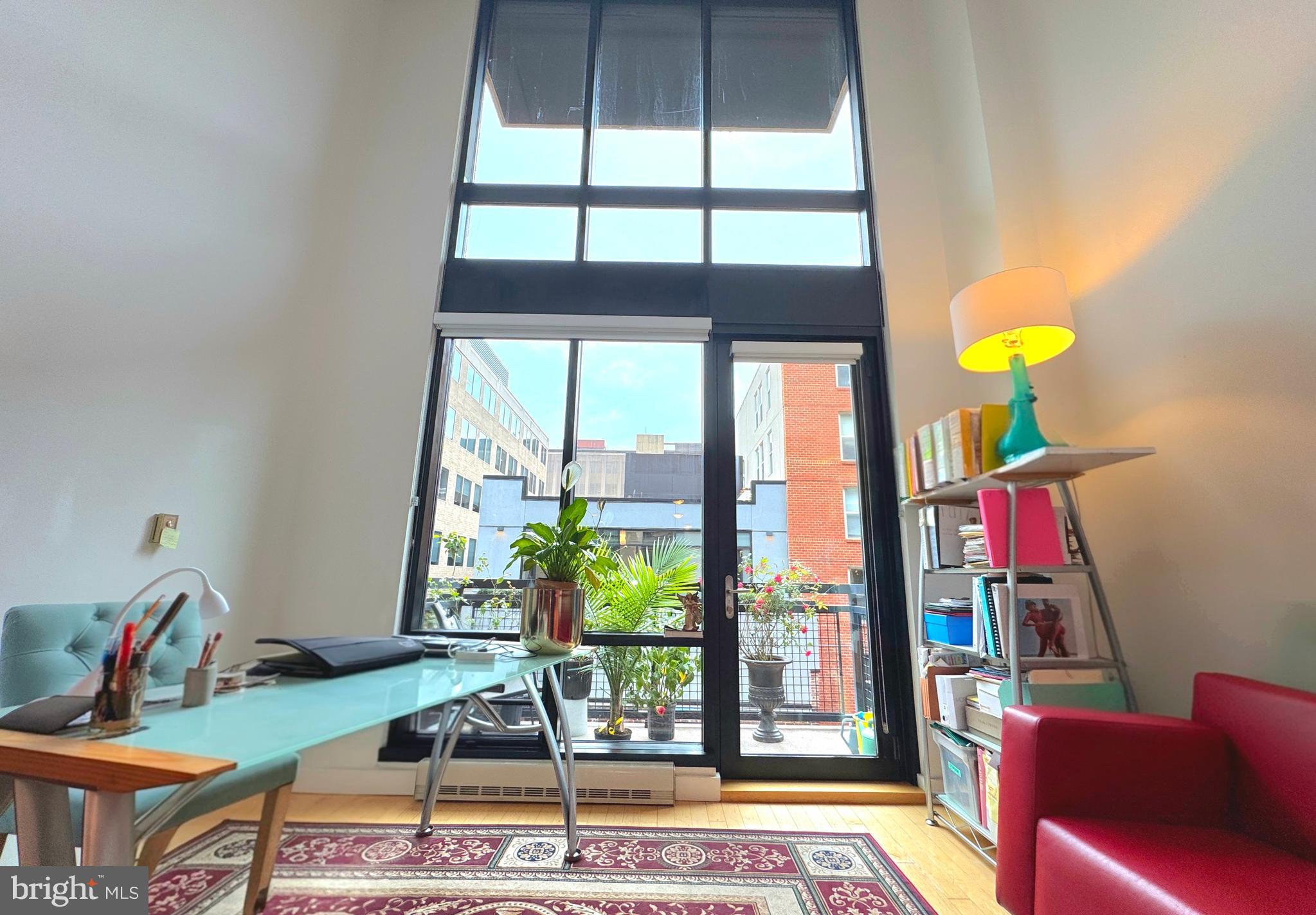 912 F Street Northwest, Unit 703 Washington, DC 20004 - Photo 1 of 52 a living room with furniture and a floor to ceiling window