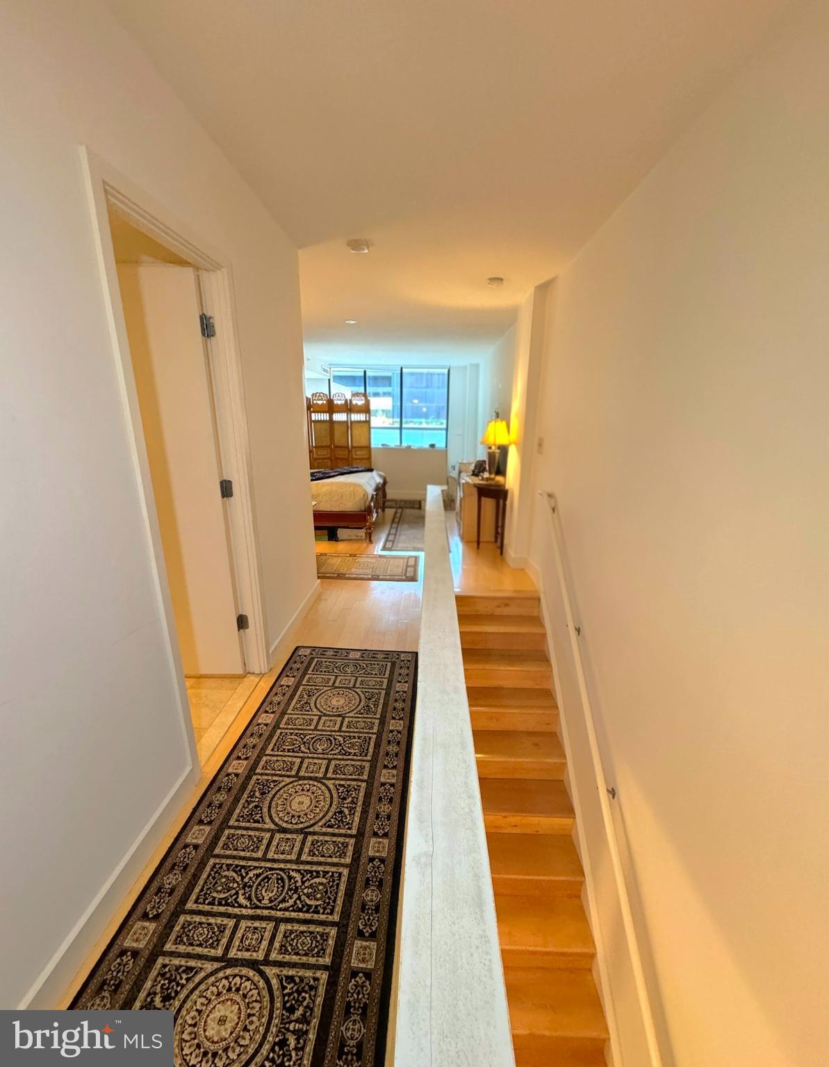 912 F Street Northwest, Unit 703 Washington, DC 20004 - Photo 22 of 52 a hallway with white cabinets and rug