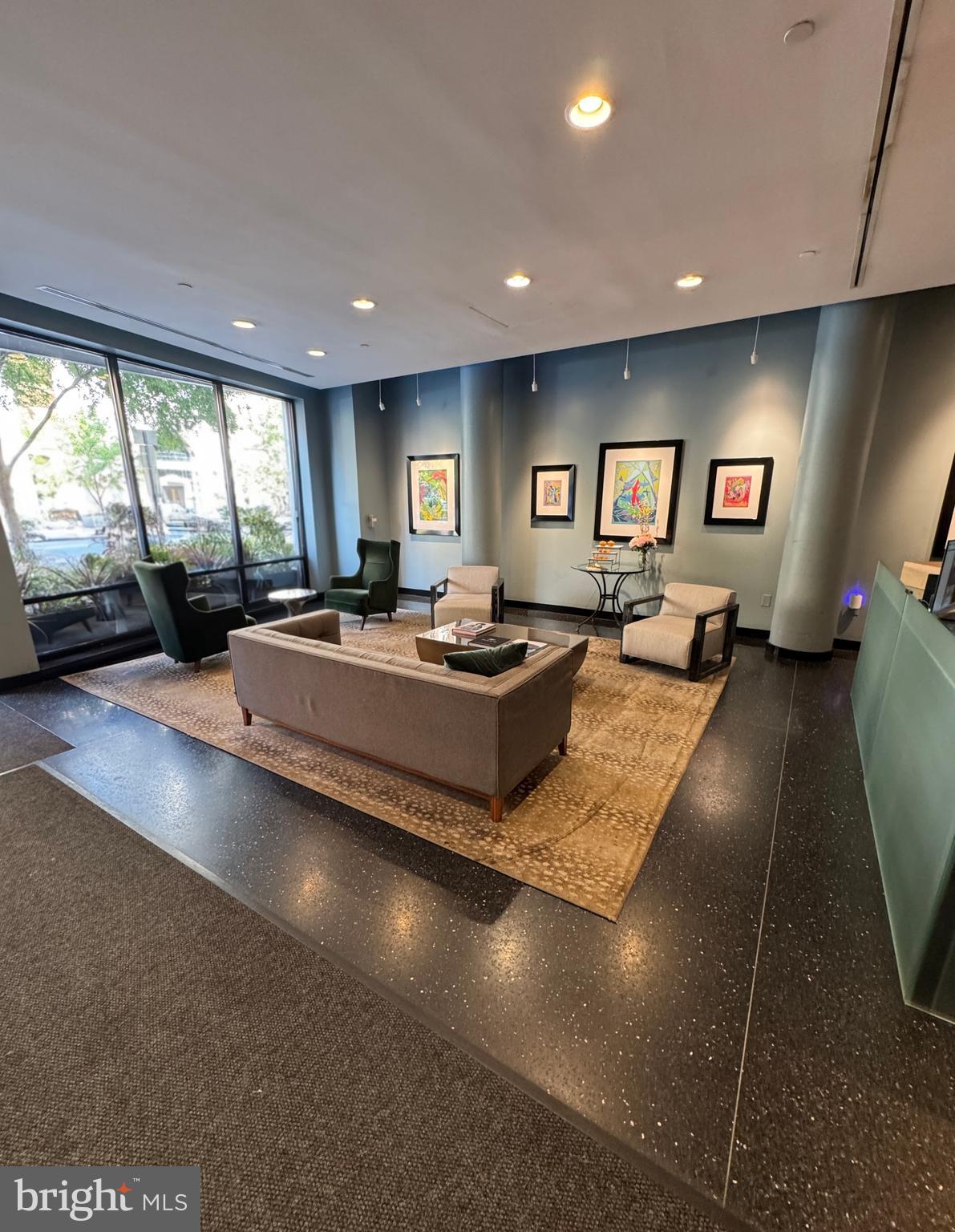 912 F Street Northwest, Unit 703 Washington, DC 20004 - Photo 31 of 56 a living room with hard wood flooring and furniture