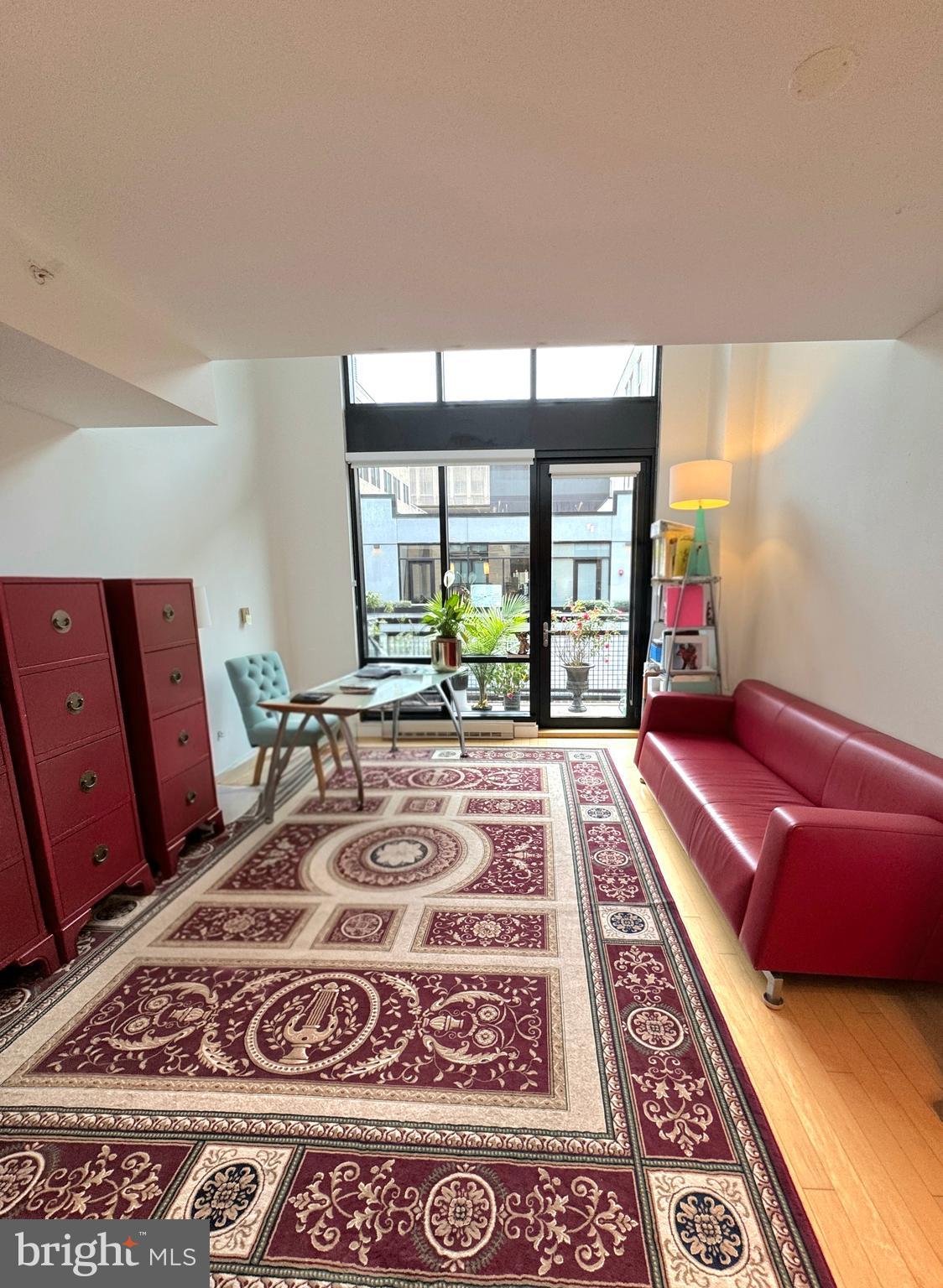 912 F Street Northwest, Unit 703 Washington, DC 20004 - Photo 6 of 52 a living room with a large rug