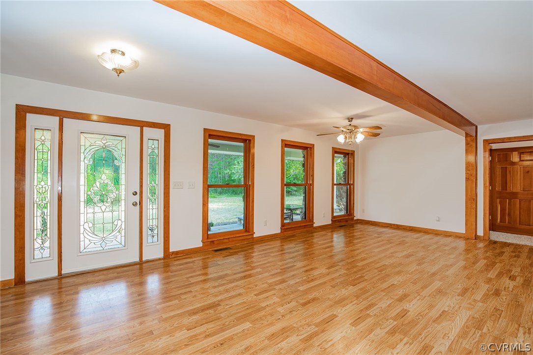 3409 Lowry Road Columbia, VA 23038 - Photo 3 of 37 a view of an empty room with window and wooden floor