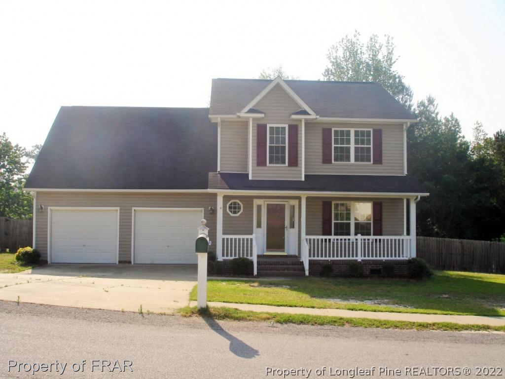 5807 Spreading Branch Road Hope Mills, NC 28348 - Photo 1 of 26 a front view of a house with a yard