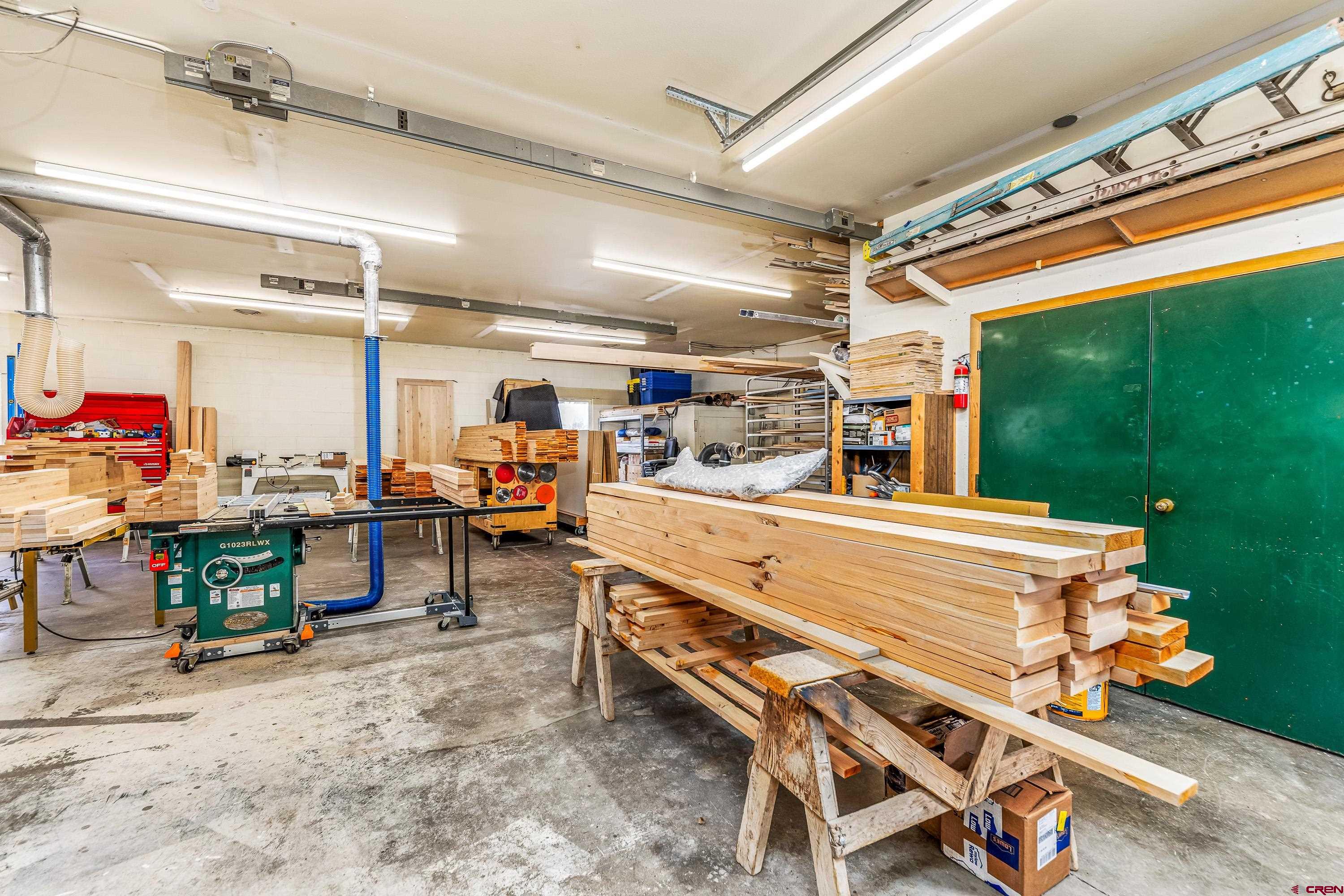 875 West Main Street Cedaredge, CO 81413 - Photo 13 of 35 a room with lots of furniture and a chandelier