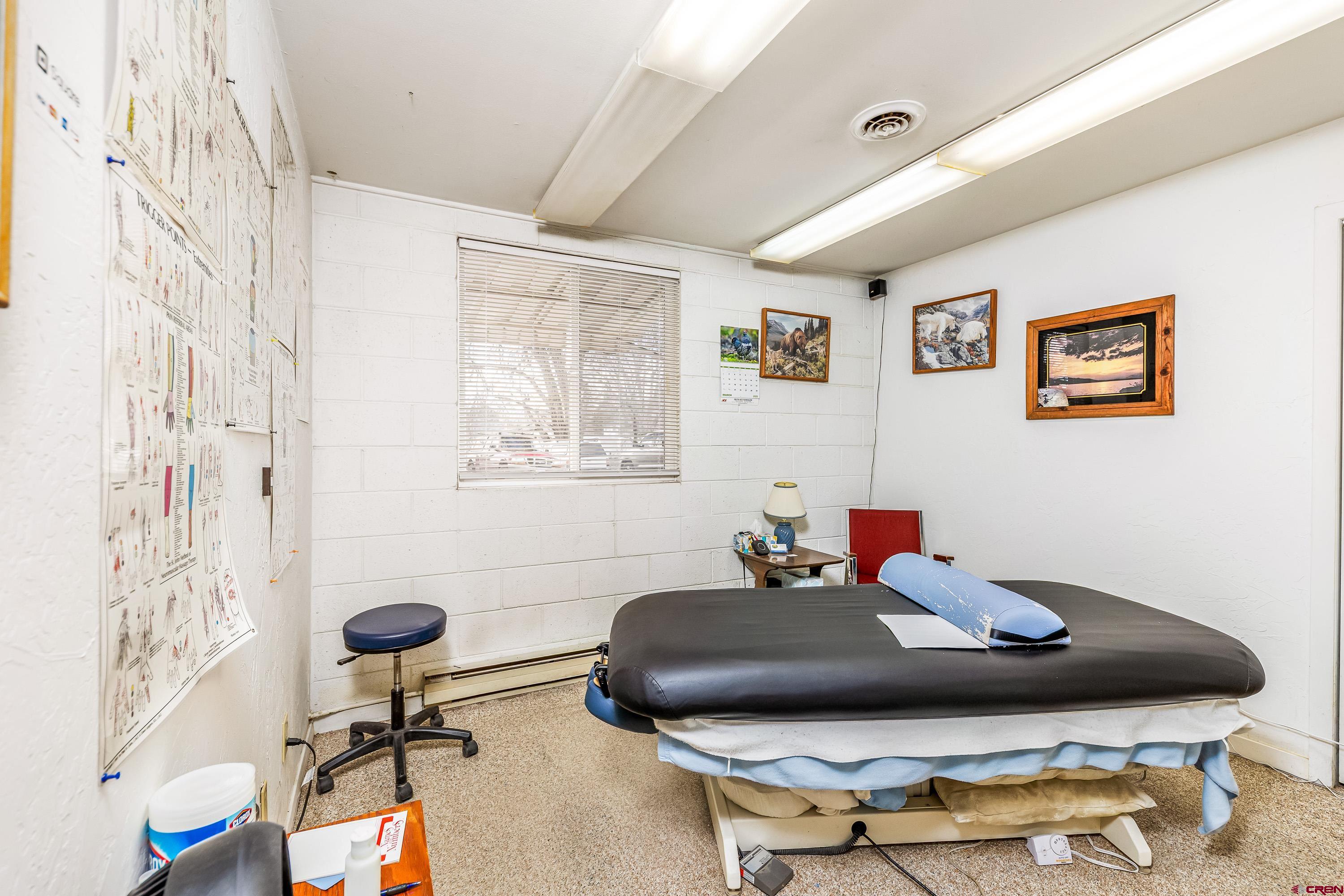 875 West Main Street Cedaredge, CO 81413 - Photo 18 of 35 a living room with furniture and a mirror