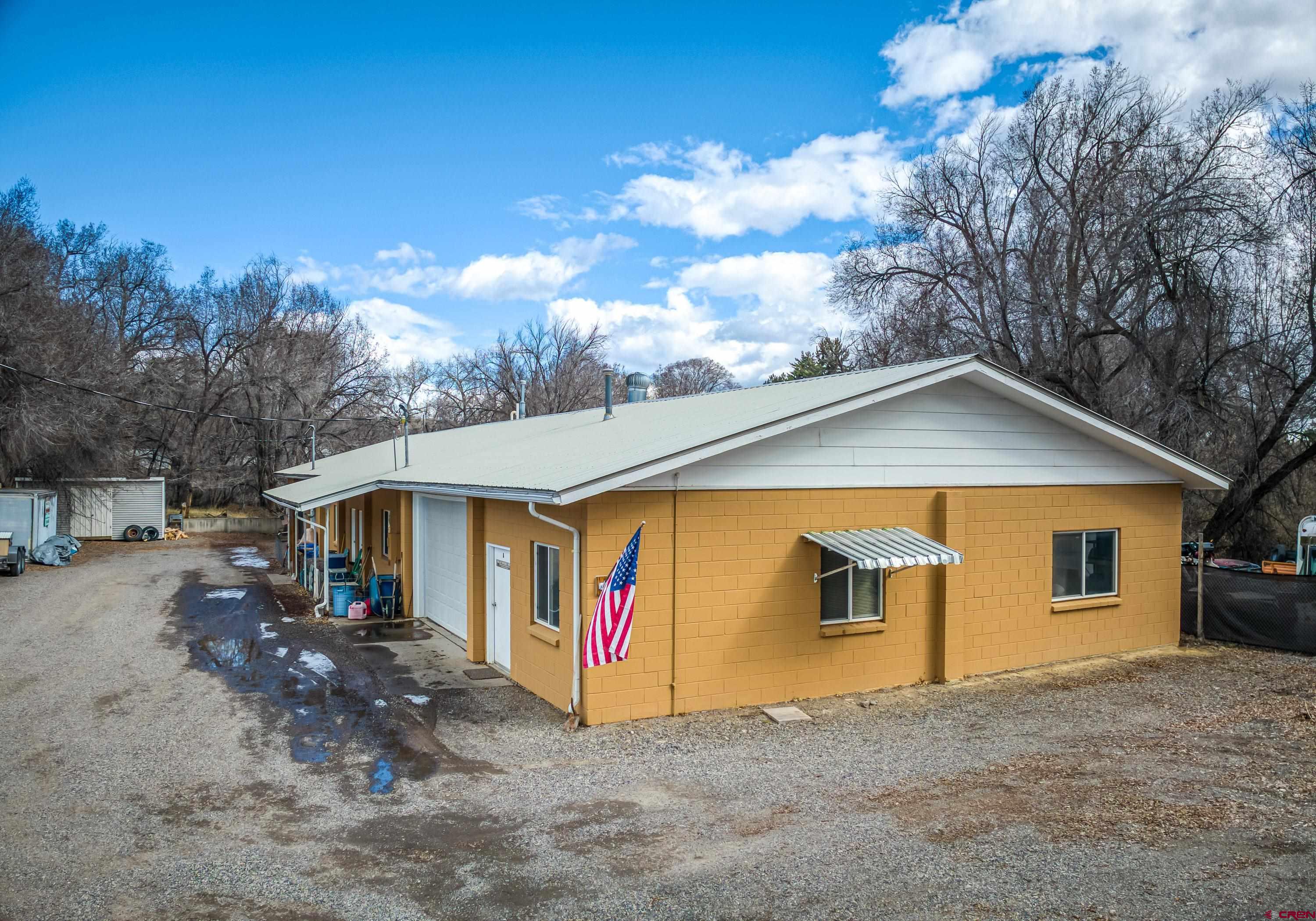875 West Main Street Cedaredge, CO 81413 - Photo 2 of 35 a view of house and outdoor space