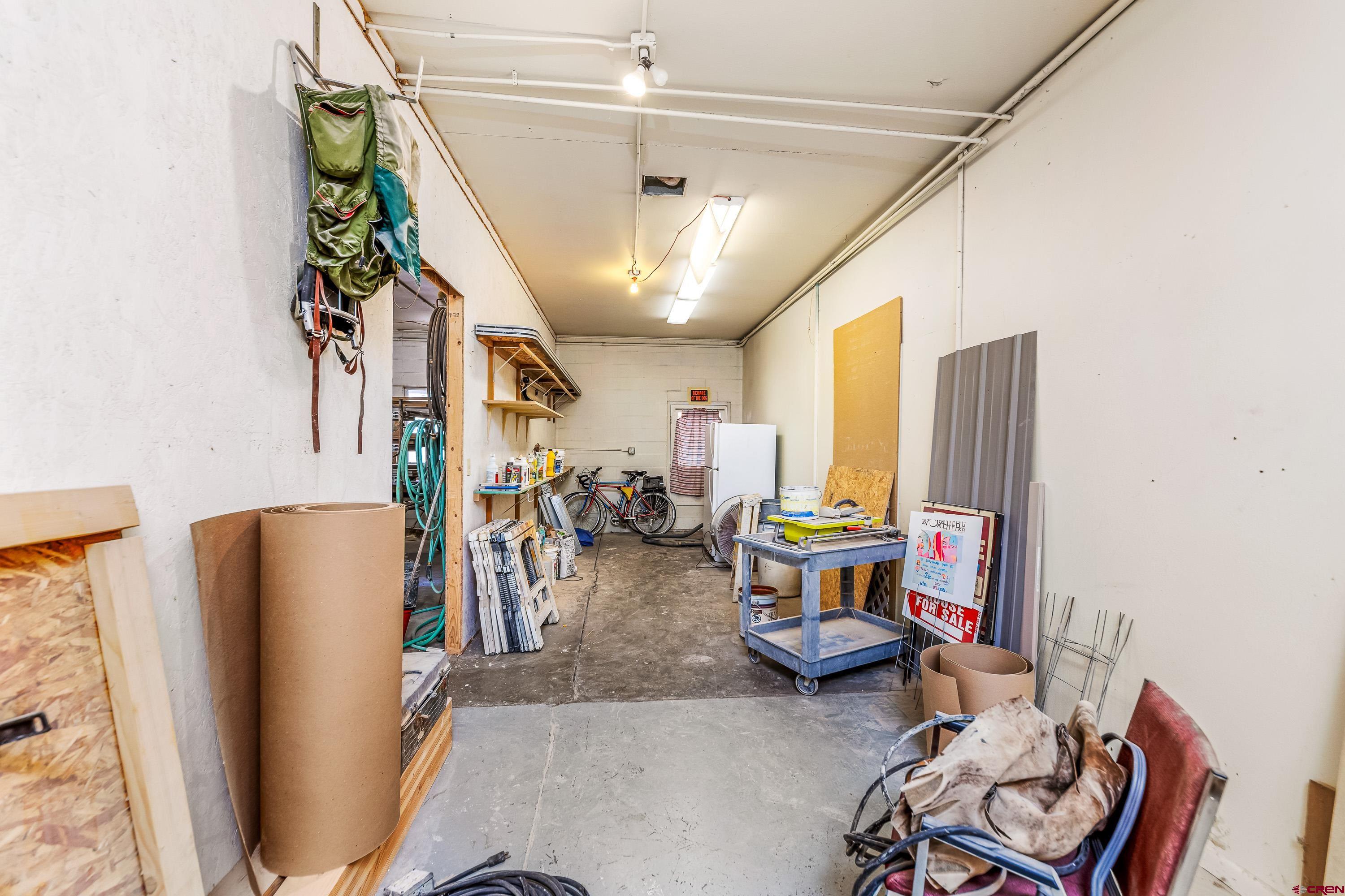 875 West Main Street Cedaredge, CO 81413 - Photo 27 of 35 a living room with furniture and a chandelier