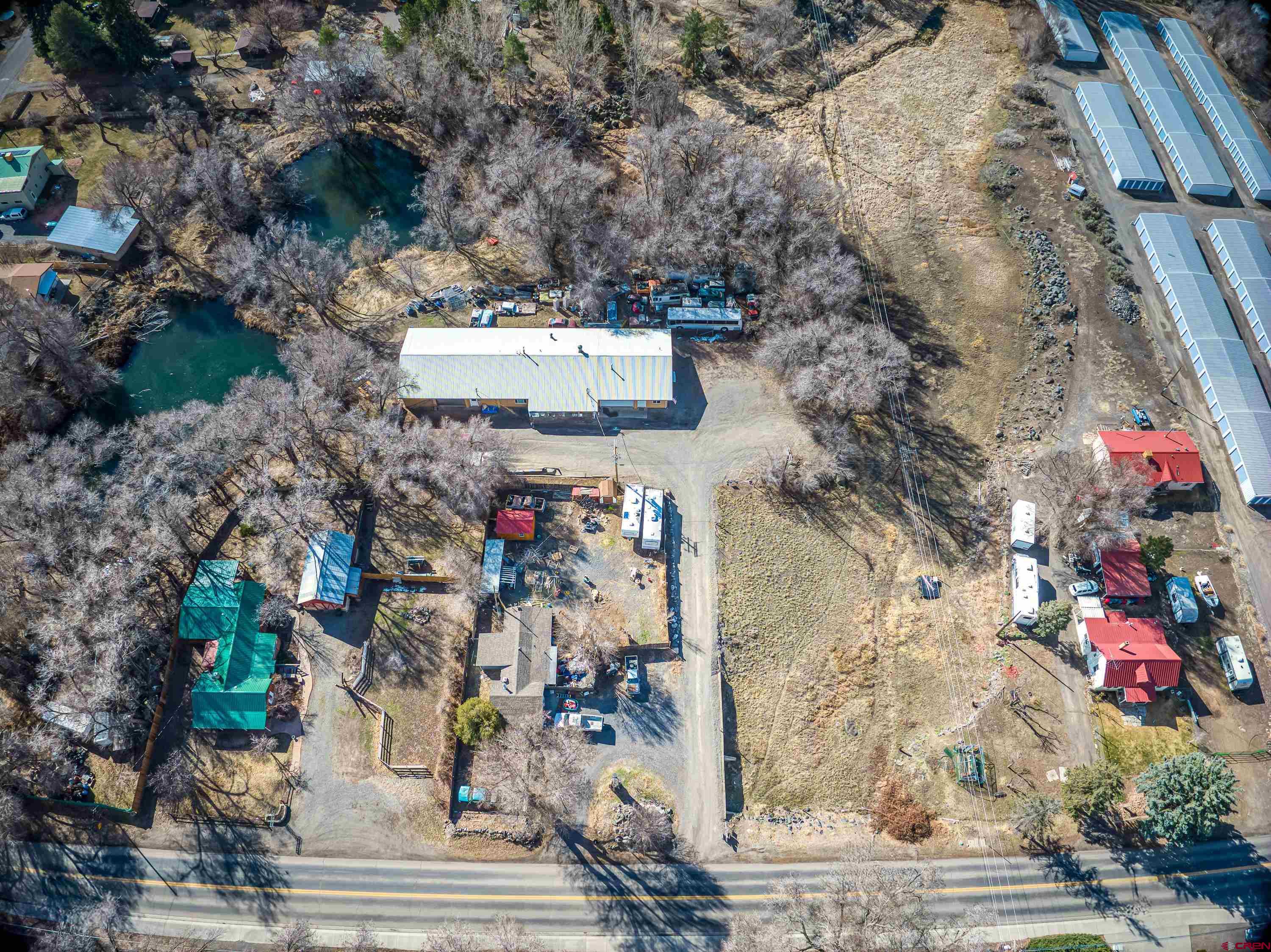 875 West Main Street Cedaredge, CO 81413 - Photo 35 of 35 an aerial view of a house with a yard and large tree