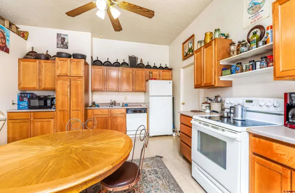 a kitchen with stainless steel appliances granite countertop a sink and cabinets