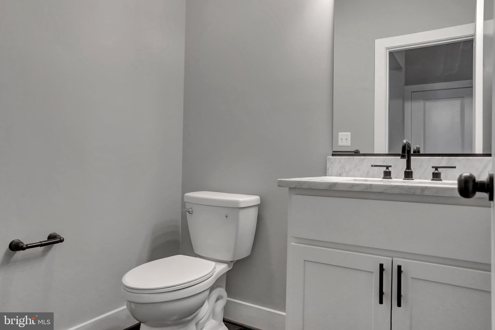 7319 Talbot Run Road Mount Airy, MD 21771 - Photo 13 of 54 Main level half bathroom has marble counter top