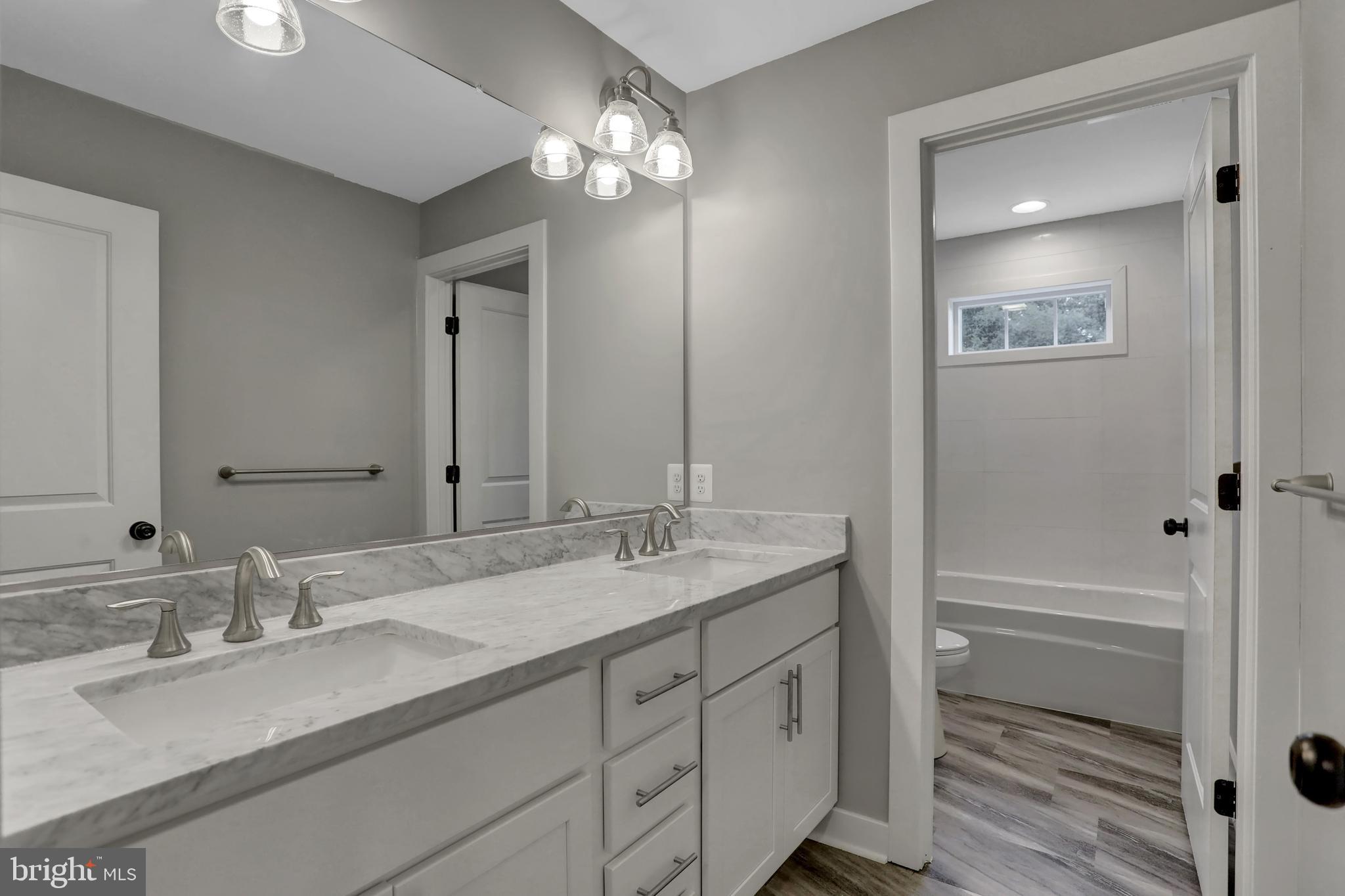 7319 Talbot Run Road Mount Airy, MD 21771 - Photo 36 of 54 Upper level full bathroom has vinyl tile floor