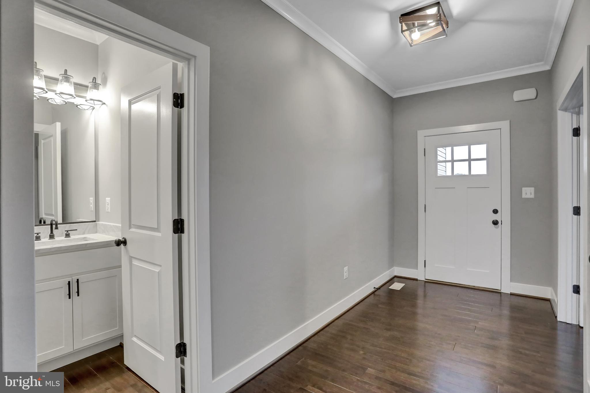 7319 Talbot Run Road Mount Airy, MD 21771 - Photo 8 of 54 The foyer has hardwood floor & a half bathroom