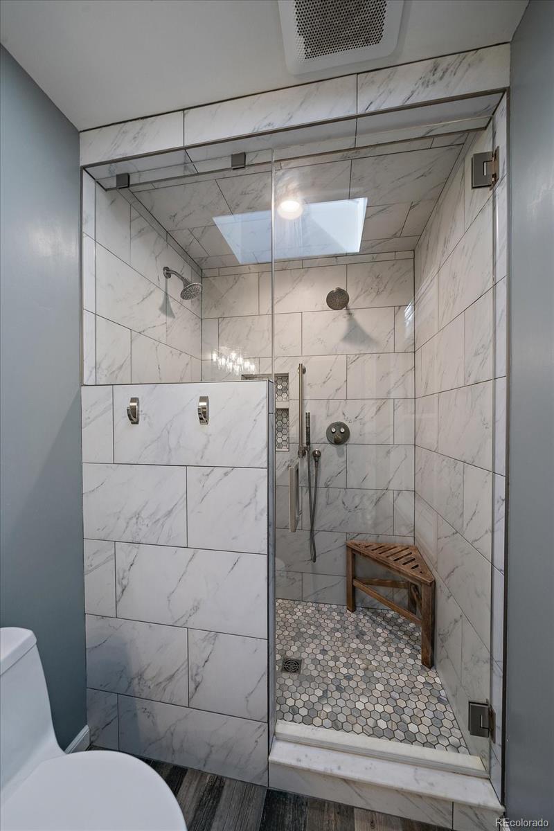 11842 South Geronimo Trail Conifer, CO 80433 - Photo 20 of 41 a bathroom with a shower and toilet