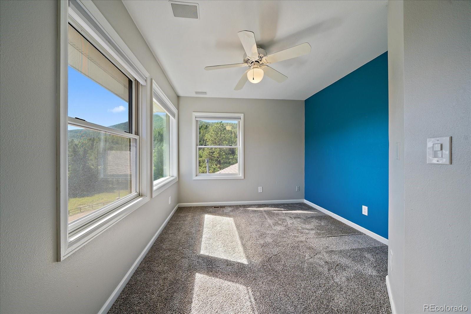 11842 South Geronimo Trail Conifer, CO 80433 - Photo 22 of 41 a view of an empty room and window