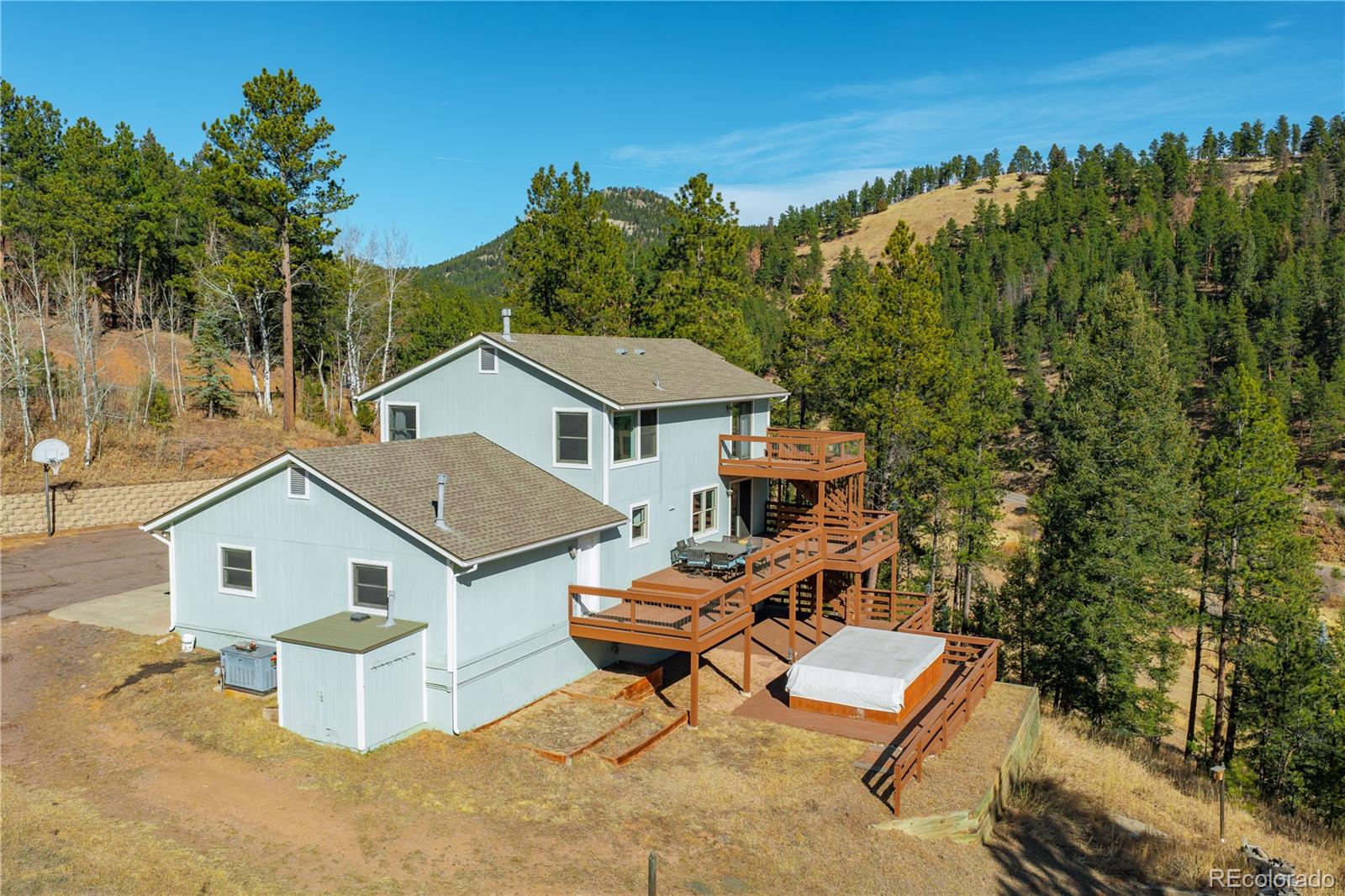 11842 South Geronimo Trail Conifer, CO 80433 - Photo 34 of 41 an aerial view of a house with a yard and sitting area