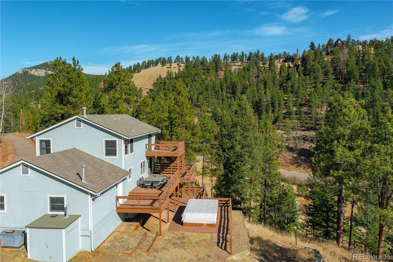 11842 South Geronimo Trail Conifer, CO 80433 - Photo 35 of 41 a view of a patio with a table and chairs