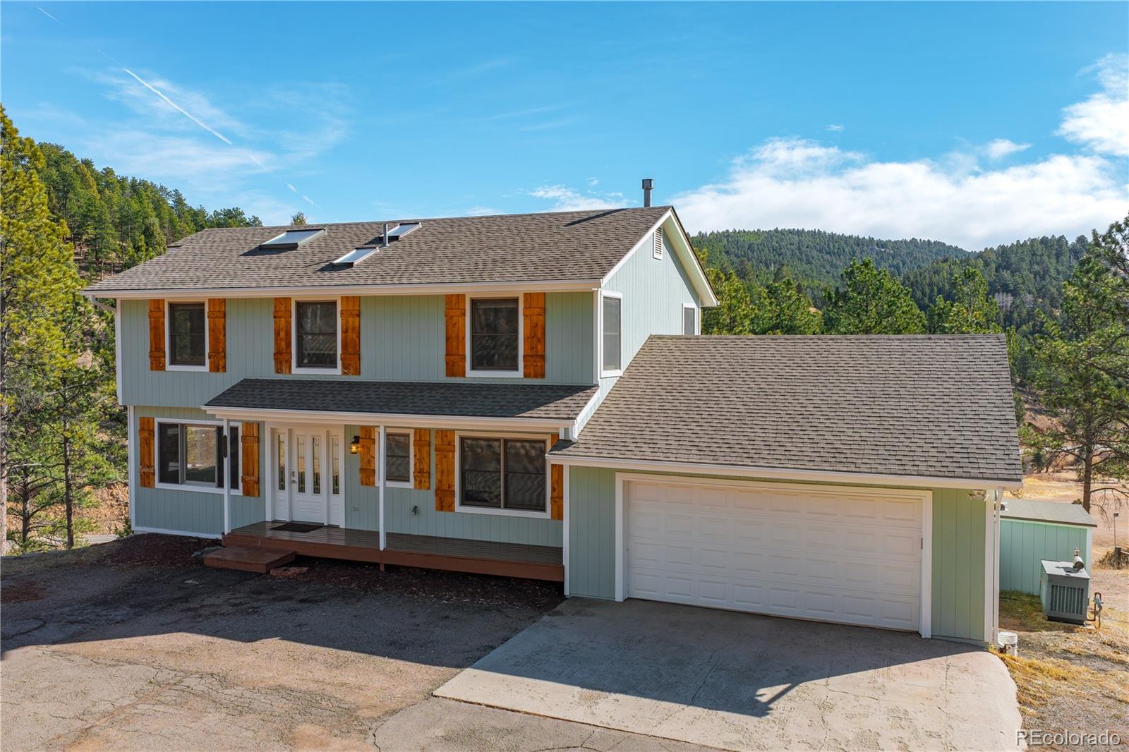 11842 South Geronimo Trail Conifer, CO 80433 - Photo 4 of 41 a aerial view of a house with a yard