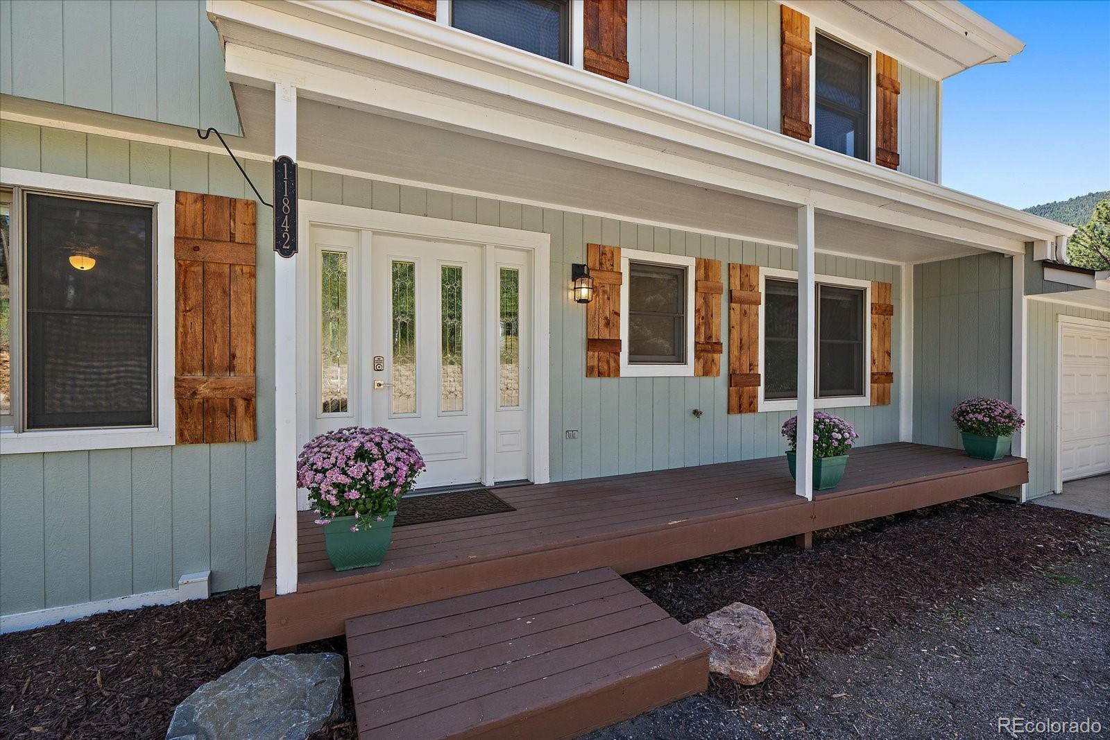 11842 South Geronimo Trail Conifer, CO 80433 - Photo 5 of 41 a front view of a house