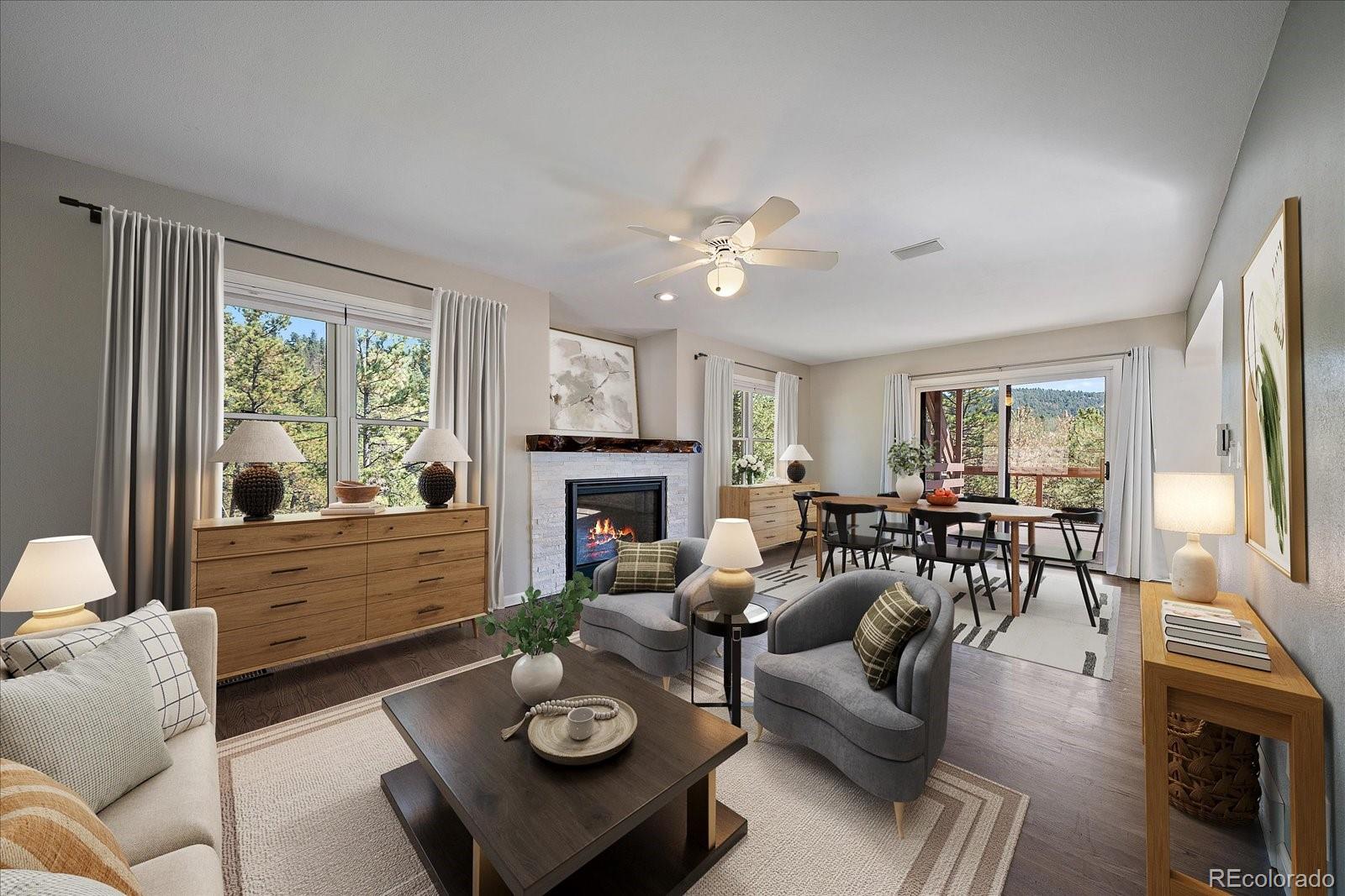 11842 South Geronimo Trail Conifer, CO 80433 - Photo 7 of 41 a living room with furniture fireplace and a large window