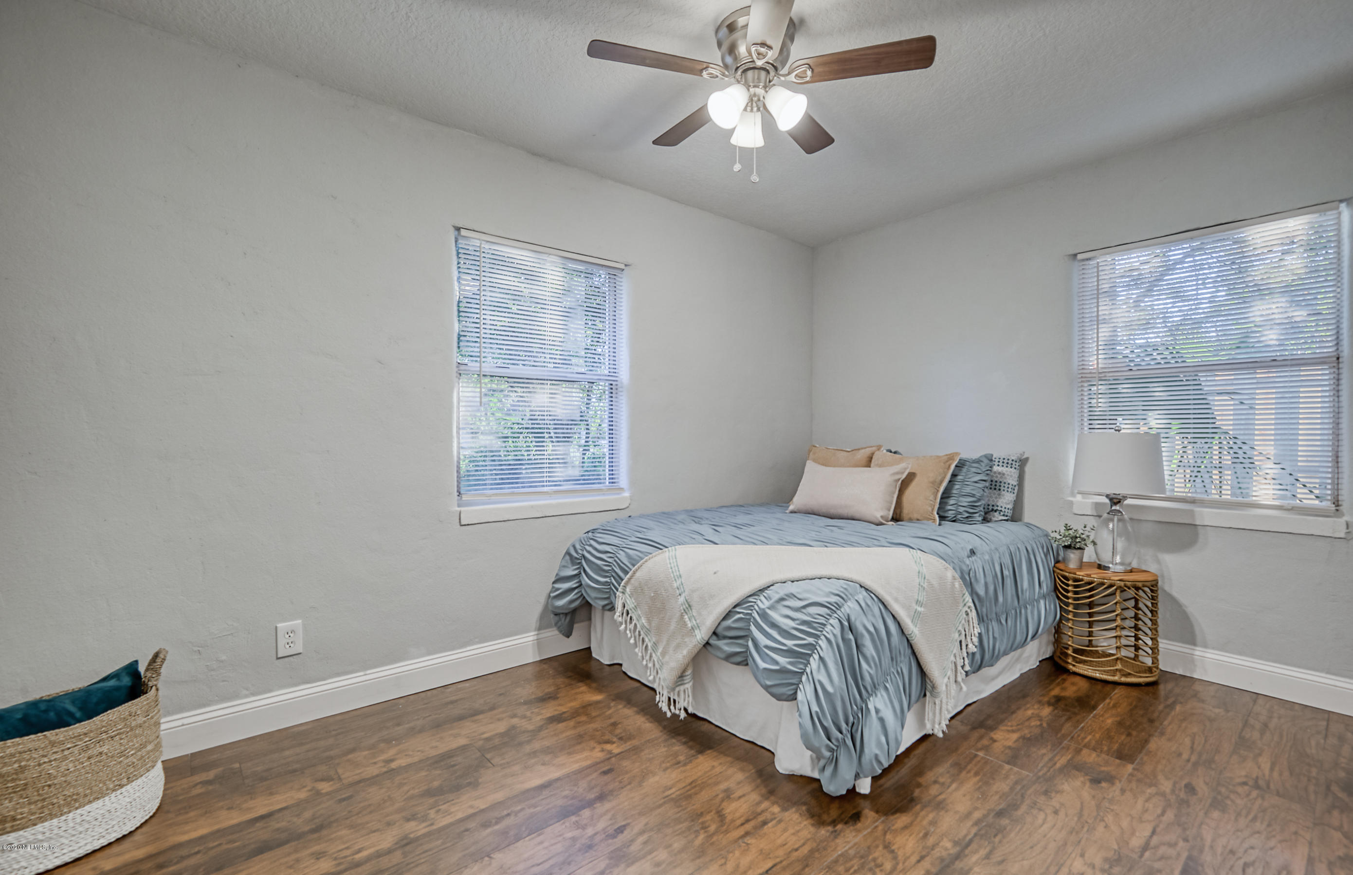 6711 Ryance Road Jacksonville, FL 32211 - Photo 17 of 26 a bedroom with a large bed and a window