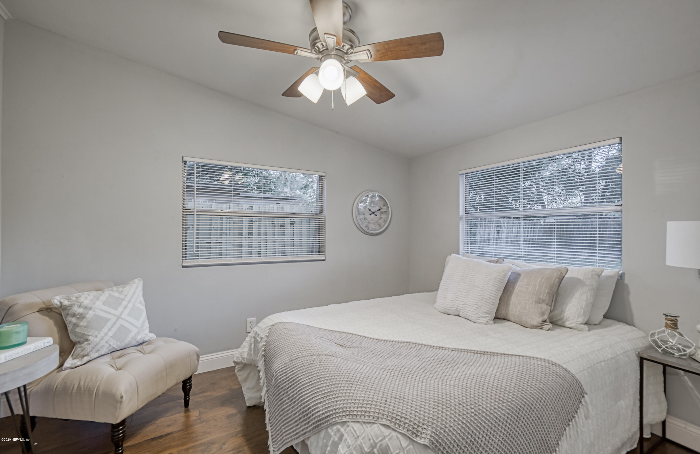 6711 Ryance Road Jacksonville, FL 32211 - Photo 20 of 26 a bedroom with a large bed and a couch