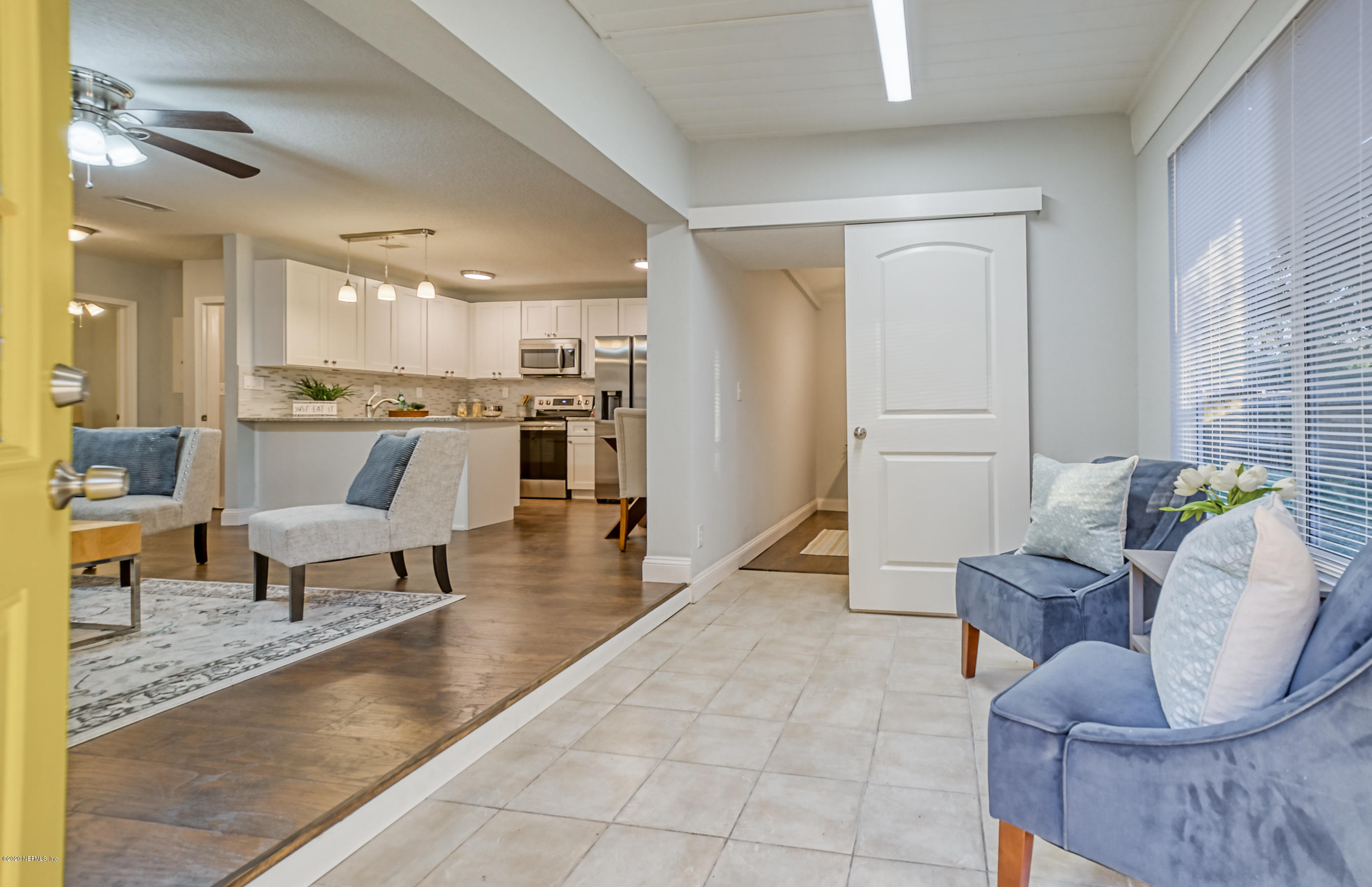 6711 Ryance Road Jacksonville, FL 32211 - Photo 2 of 26 a living room with couches and kitchen view with wooden floor