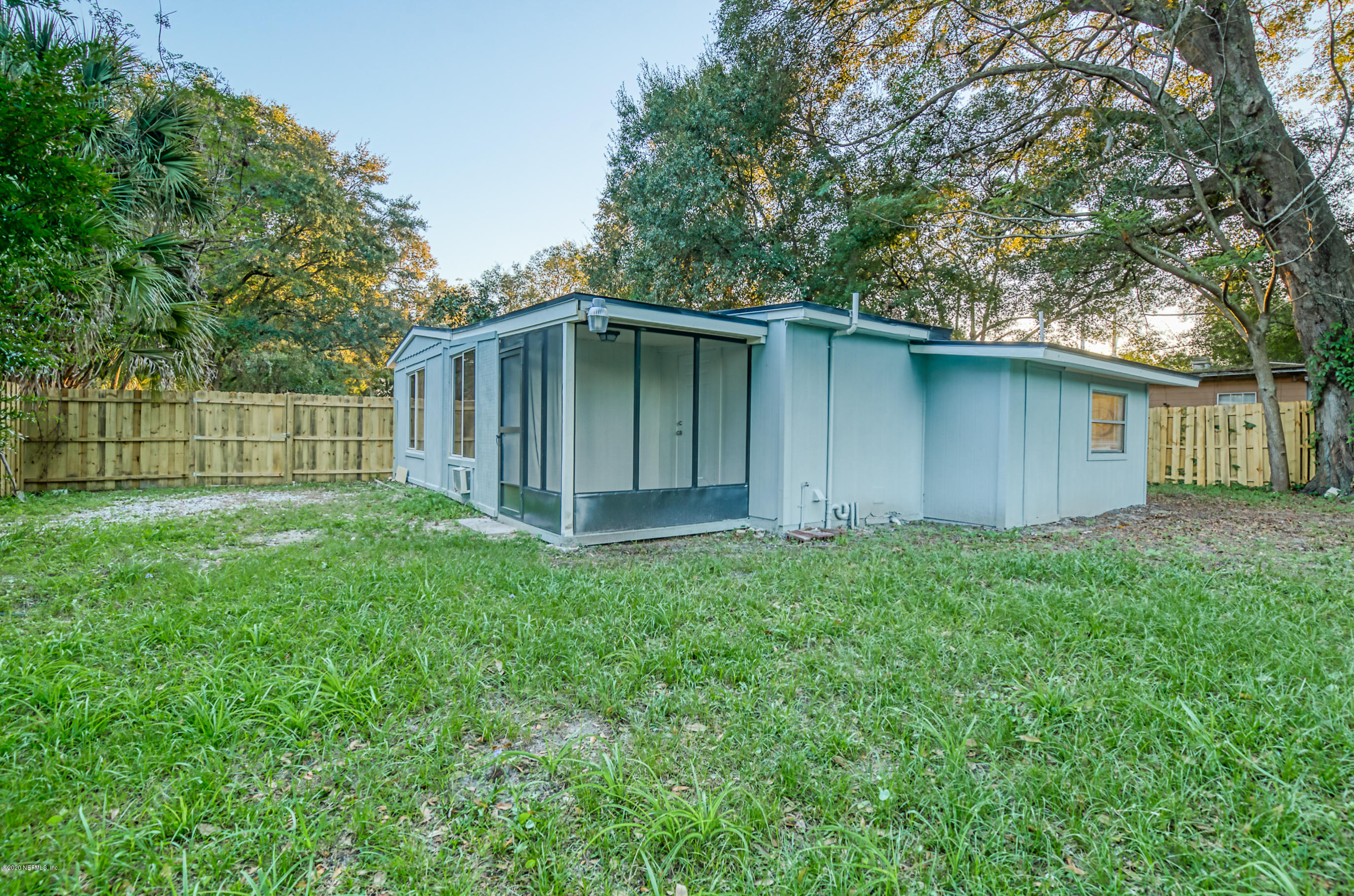 6711 Ryance Road Jacksonville, FL 32211 - Photo 25 of 26 a house with green field in front of it