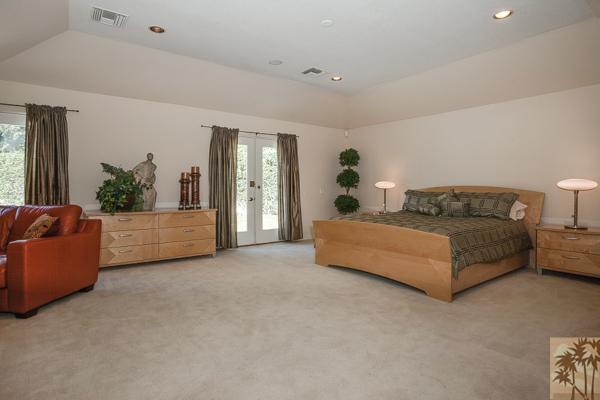 2 Boothill Circle Rancho Mirage, CA 92270 - Photo 12 of 42 a spacious bedroom with a bed and a couch