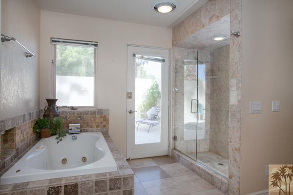 2 Boothill Circle Rancho Mirage, CA 92270 - Photo 15 of 42 a bathroom with a tub a window and a sink