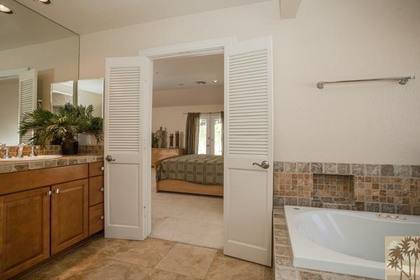 2 Boothill Circle Rancho Mirage, CA 92270 - Photo 16 of 42 a en suite bathroom with a tub sink and mirror