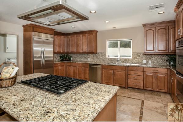 2 Boothill Circle Rancho Mirage, CA 92270 - Photo 3 of 42 a kitchen with a stove a sink and a refrigerator