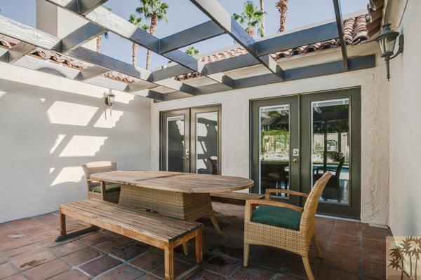 2 Boothill Circle Rancho Mirage, CA 92270 - Photo 21 of 42 a view of an outside dining space with a table and chairs