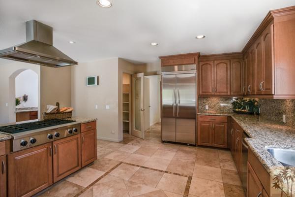 2 Boothill Circle Rancho Mirage, CA 92270 - Photo 24 of 42 a kitchen with stainless steel appliances granite countertop a stove a sink and a refrigerator
