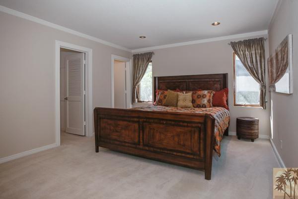 2 Boothill Circle Rancho Mirage, CA 92270 - Photo 4 of 42 a bedroom with a bed lamp and a window