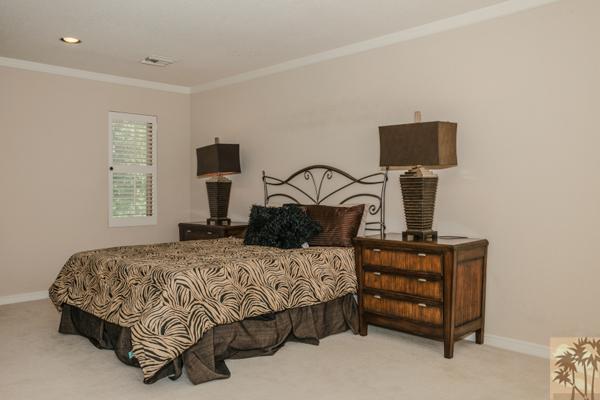 2 Boothill Circle Rancho Mirage, CA 92270 - Photo 32 of 42 a bedroom with a bed and a night stand