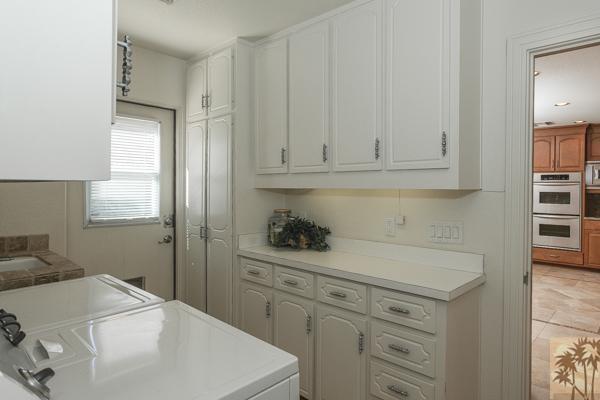 2 Boothill Circle Rancho Mirage, CA 92270 - Photo 39 of 42 a kitchen with a sink and cabinets