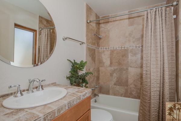 2 Boothill Circle Rancho Mirage, CA 92270 - Photo 5 of 42 a bathroom with a sink and a mirror