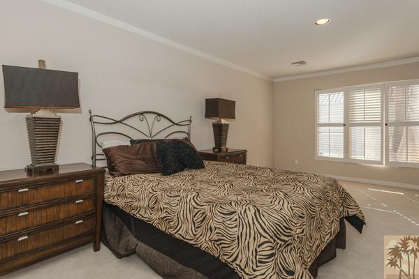 2 Boothill Circle Rancho Mirage, CA 92270 - Photo 41 of 42 a bedroom with a bed and flat screen tv