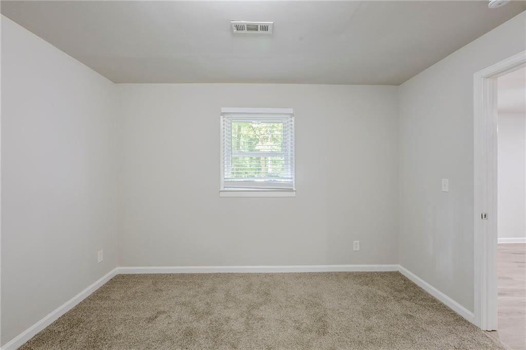3735 Boulder Park Drive Southwest Atlanta, GA 30331 - Photo 18 of 29 an empty room with windows