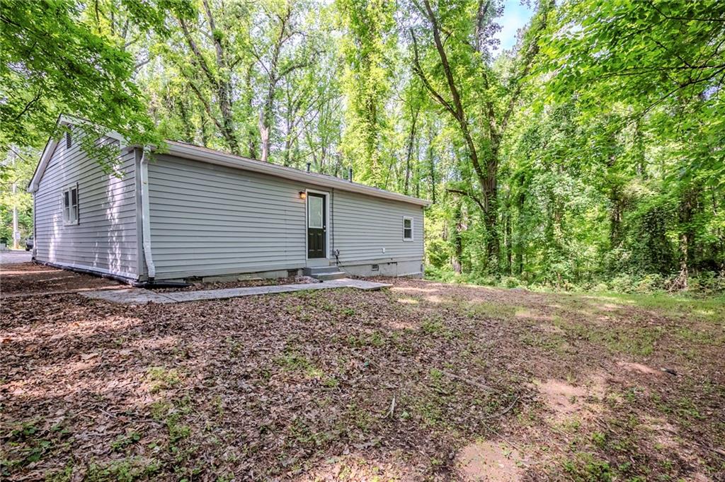 3735 Boulder Park Drive Southwest Atlanta, GA 30331 - Photo 25 of 29 a backyard of a house with lots of green space