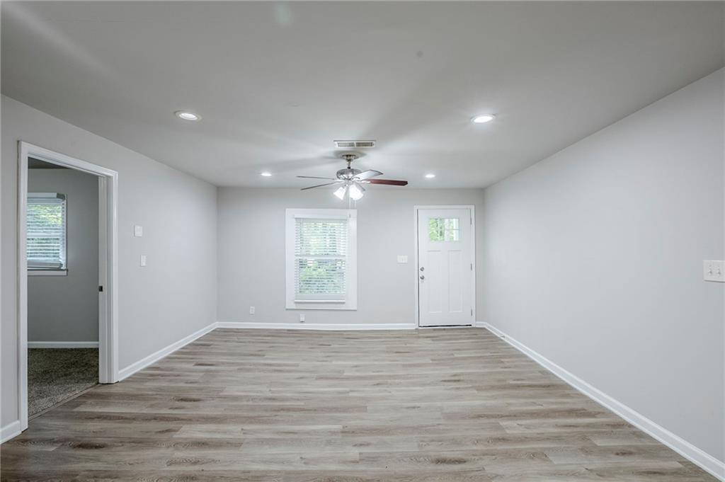 3735 Boulder Park Drive Southwest Atlanta, GA 30331 - Photo 6 of 29 wooden floor in an empty room with a window