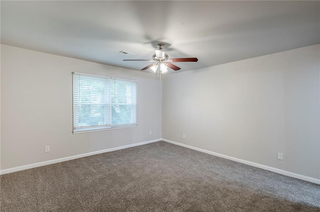 3735 Boulder Park Drive Southwest Atlanta, GA 30331 - Photo 8 of 29 an empty room with a window and a fan