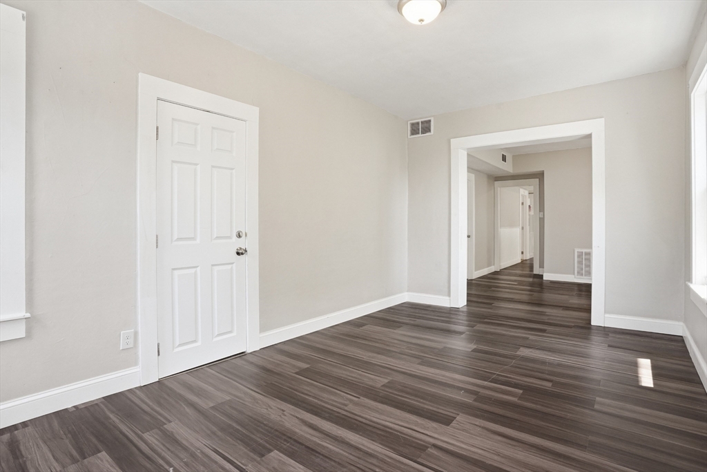 196 Irving Street Fall River, MA 02723 - Photo 15 of 34 a view of a hallway with wooden floor
