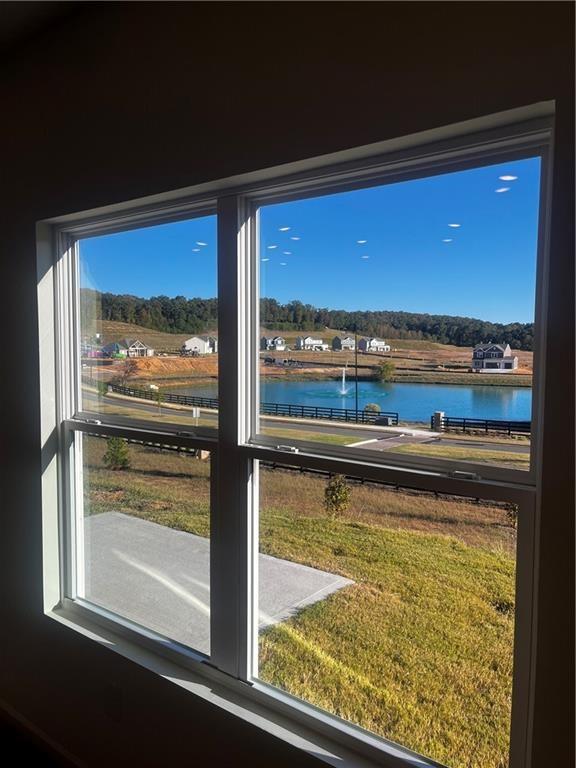 118 Lavender Circle Calhoun, GA 30701 - Photo 12 of 31 a view of a room with wooden floor and a floor to ceiling window